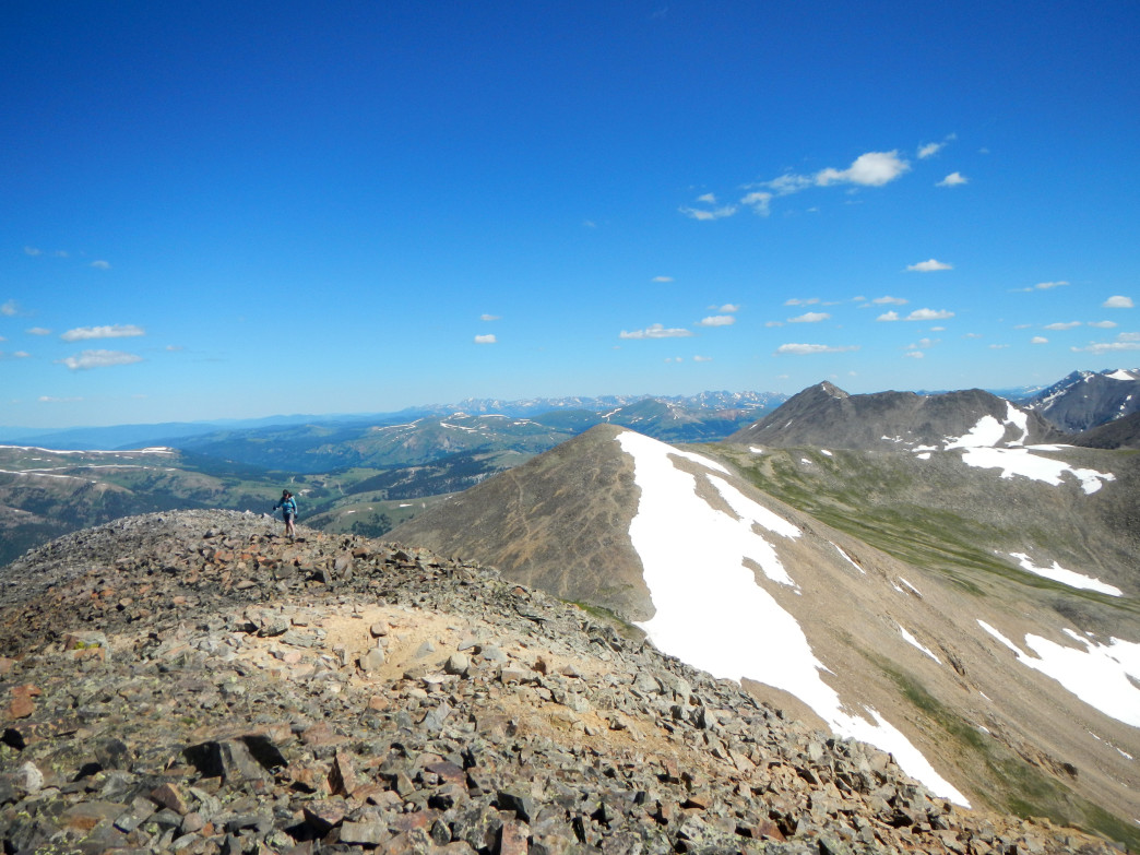 Approaching the summit of Mosquito Peak with Treasurevault Mountain in the background.